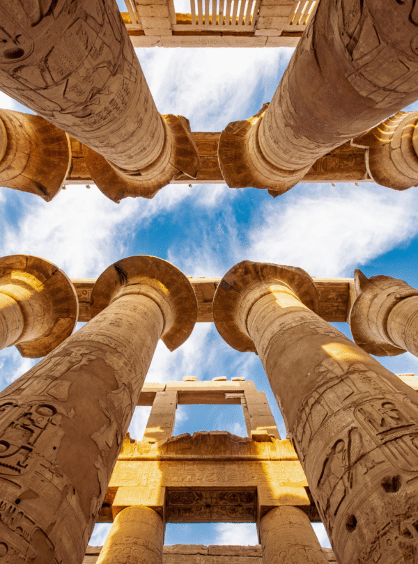 Massive stone columns inside Karnak Temple in Luxor