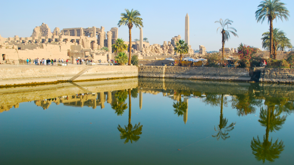 Sacred Lake reflecting monuments inside Karnak Temple